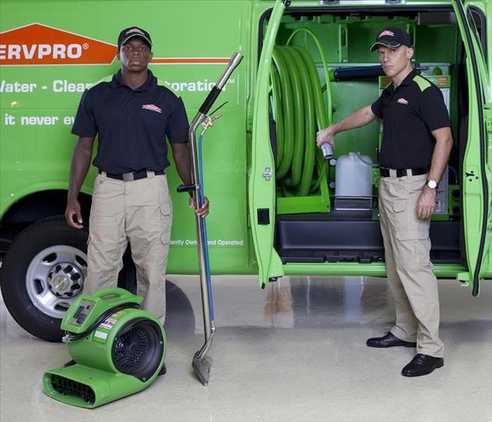 Two SERVPRO teams with water extracting equipment